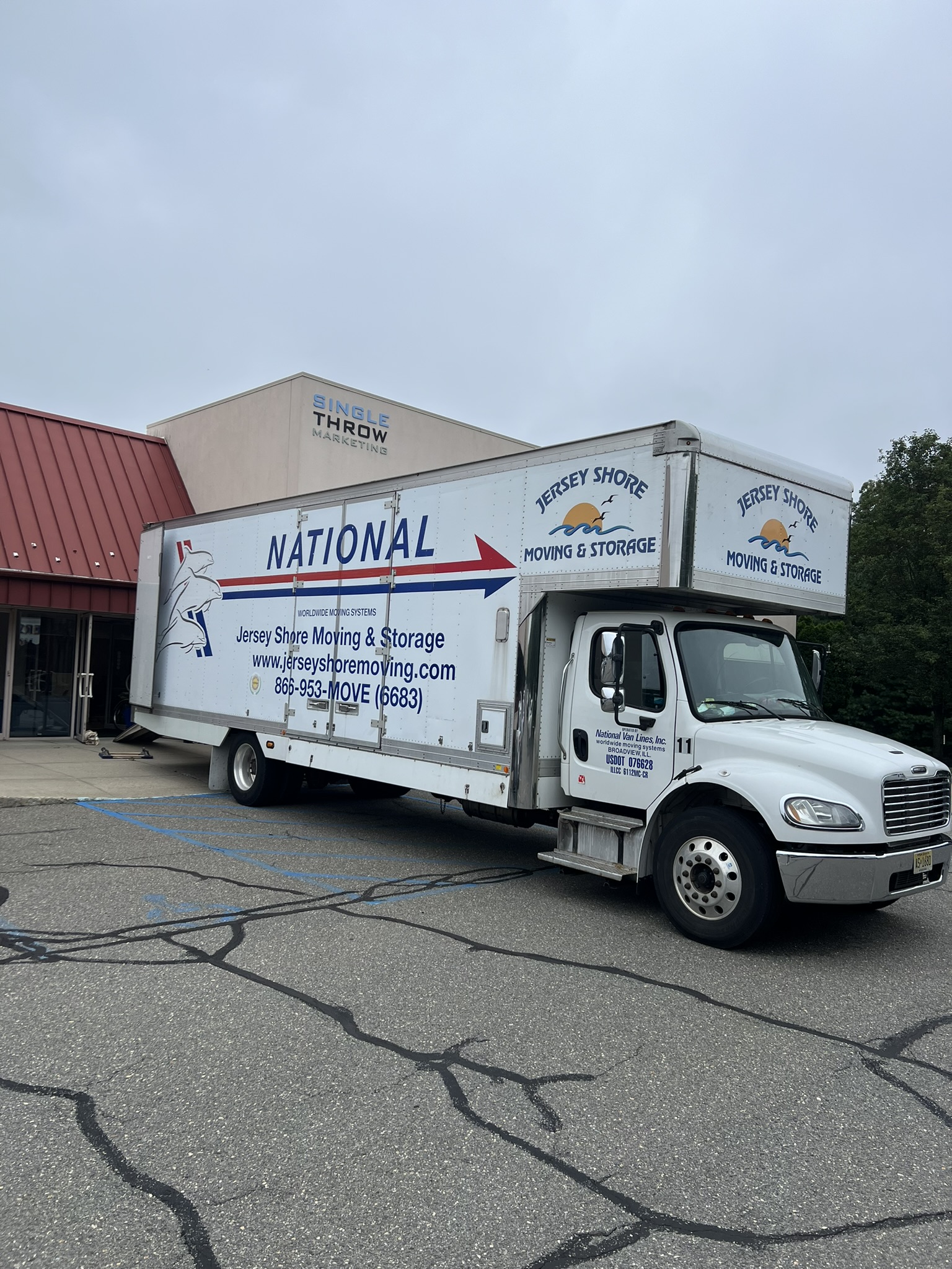 moving_truck_outside_of_wall_office